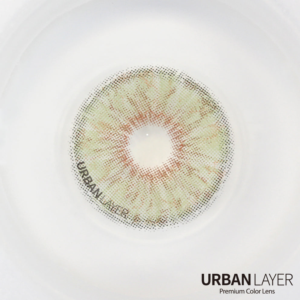 Berkeley green Urban Layer colored contact lenses showcasing a vibrant green hue in a clear lens case.