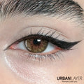 Close-up of Cleopatra Gold Urban Layer colored contact lenses by Urban-Layer, showing the gold and brown design on the eye.