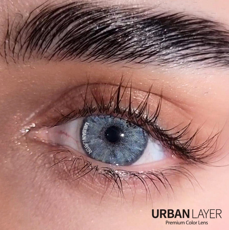 Urban-Layer Gemini Ash Blue urban layer colored contact lenses, close-up of blue-tinted lenses in a clear case