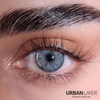 Gemini Ash Blue Urban-Layer colored contact lenses displayed in the image, showcasing the vibrant blue design.