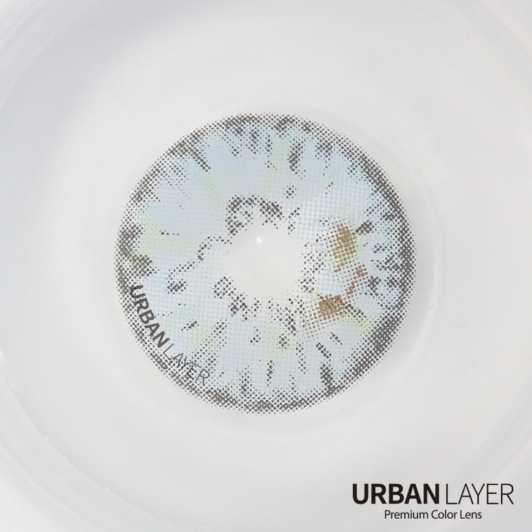 Urban-Layer Gemini Ash Blue colored contact lenses in a close-up view showing the vibrant blue design on the eye.