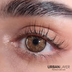 Close-up of Urban-Layer Gemini Hazel Urban Layer colored contact lenses, showing the detailed hazel design in a natural eye appearance.
