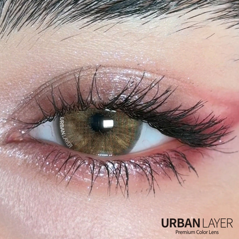 Close-up of Gemini Hazel Urban-Layer colored contact lenses showing the hazel eye design and vibrant color details.