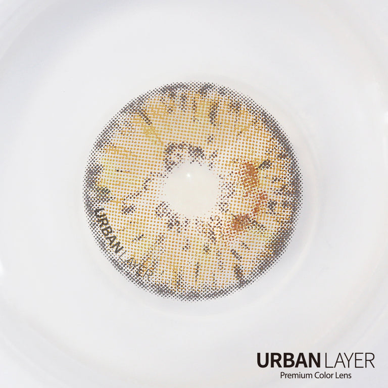 Urban-Layer Gemini Hazel Urban Layer colored contact lenses worn in an eye, showcasing the hazel tint and subtle design details.
