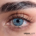 Gemini Light Blue Urban-Layer colored contact lenses in a clear lens case, highlighting the vibrant blue design.