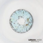 Urban-Layer Gemini Light Blue Urban Layer colored contact lenses, close-up of the vibrant blue lens design on a model's eye.