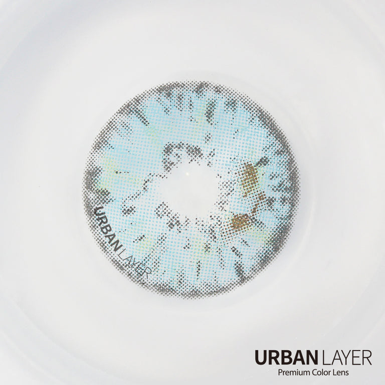 Urban-Layer Gemini Light Blue Urban Layer colored contact lenses, close-up of the vibrant blue lens design on a model's eye.