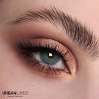 Close-up of Maldives Blue Urban-Layer colored contact lenses in a person's eye, showcasing the vibrant blue design.