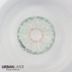 Hockney Emerald Urban-Layer colored contact lenses in a vibrant green shade, displayed in a clear lens case.