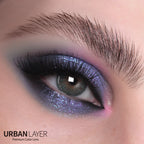Hockney Emerald Urban-Layer colored contact lenses in a vibrant green shade for a striking eye enhancement.