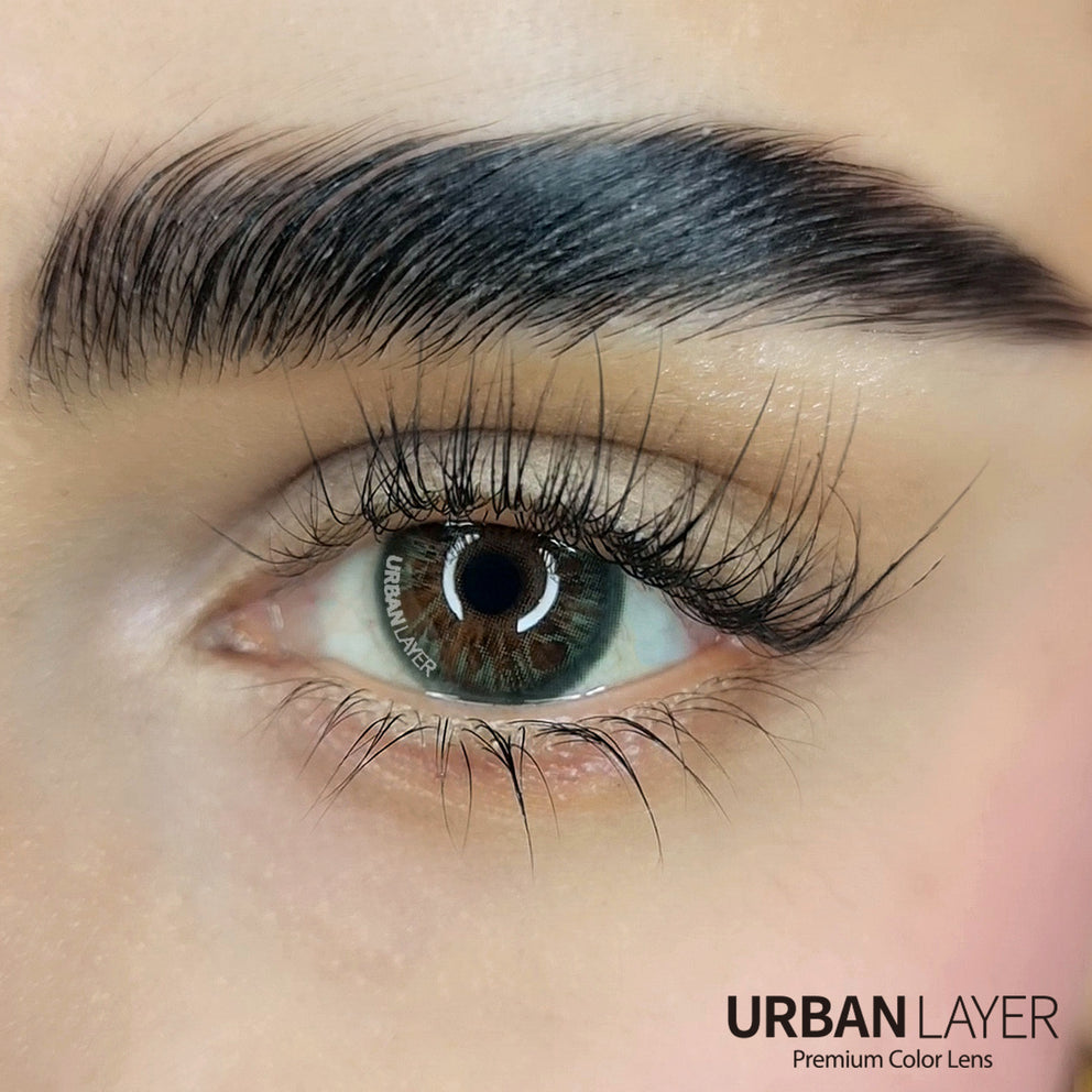 Hockney Emerald Urban-Layer colored contact lenses in a vibrant green shade, showcasing the lens design and color.